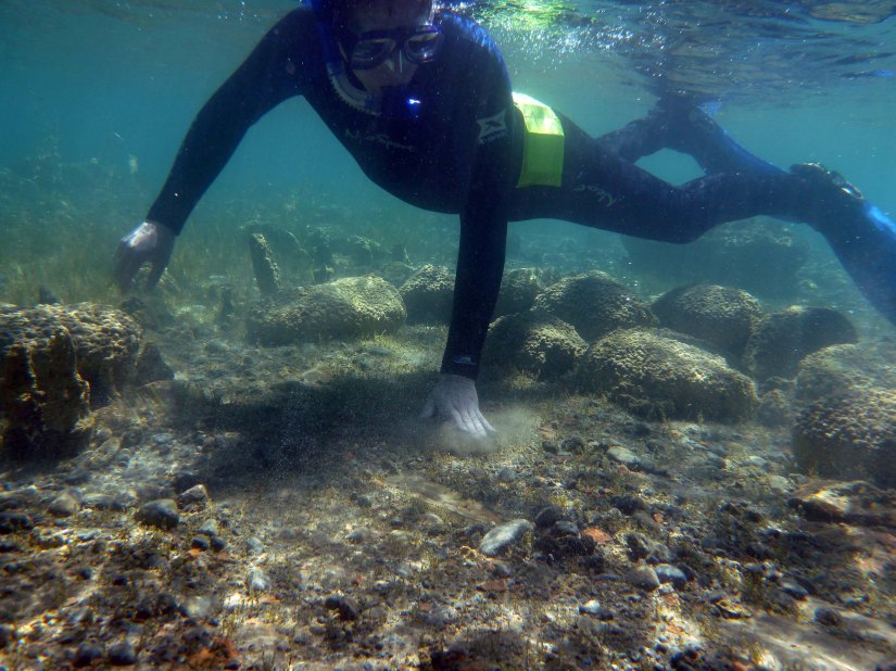 National Geographic Archaeology Fellow Fredrik Hiebert at work in Issyk Kul; Photo courtesy Brad Vest